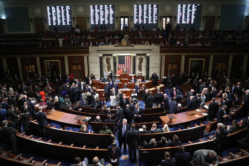 House members vote on the House resolution to move forward with procedures for the next phase of the impeachment inquiry into President Trump in the House Chamber on Capitol Hill in Washington, Thursd ...