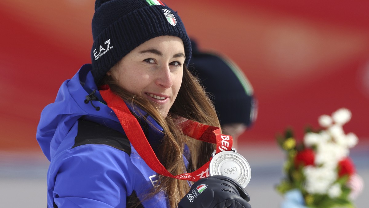 Sofia Goggia, of Italy, silver, reacts during the medal ceremony for the women's downhill at the 2022 Winter Olympics, Tuesday, Feb. 15, 2022, in the Yanqing district of Beijing. (AP Photo/Alessa ...