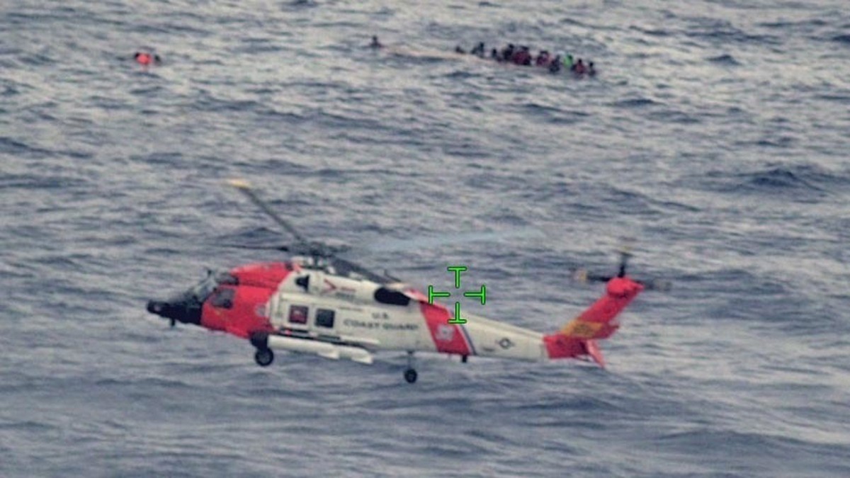 epa09943655 A handout photo made available by US Customs and Border Protection shows US Coast Guard air and surfaces rescue crews, Customs and Border Protection law enforcement boat crews and partner  ...