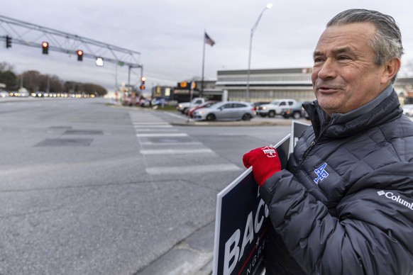 Rep. Don Bacon holds signs on the southeast corner of 90th and Dodge on Tuesday, Nov. 8, 2022, in Omaha, Neb. Bacon is up for reelection today. (Chris Machian/Omaha World-Herald via AP)
Don Bacon