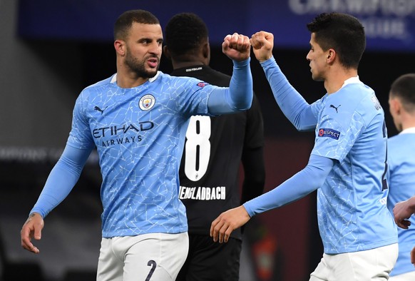 epa09078771 Kyle Walker (L) and Joao Cancelo of Manchester City celebrate after a goal against Borussia Moenchengladbach during the UEFA Champions League round of 16 second leg soccer match between Ma ...