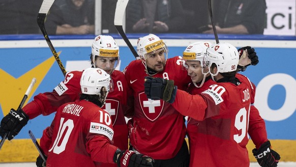 Switzerland&#039;s Andres Ambuehl, Nico Hischier, Nino Niederreiter, Philipp Kurashev and Roman Josi, from left, celebrate their goal to 5-1during the Ice Hockey World Championship group A preliminary ...