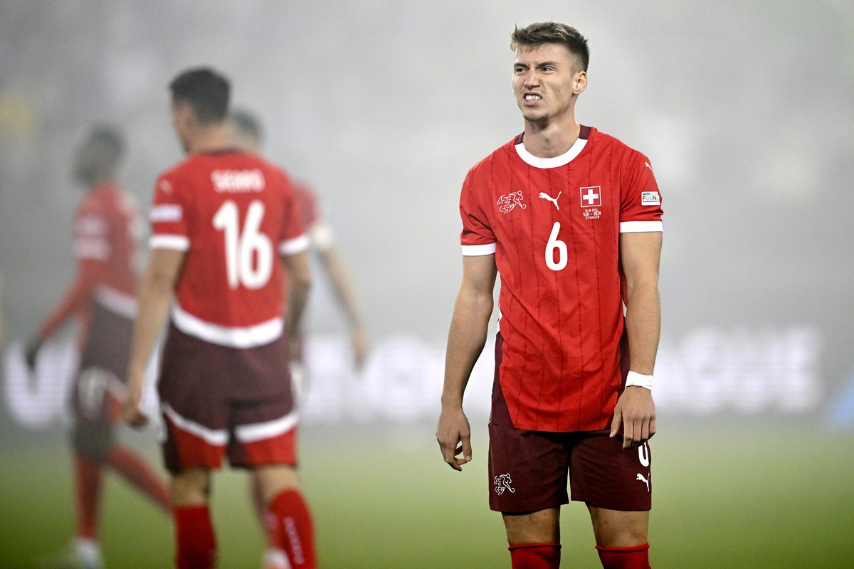 Switzerland's Christian Witzig, right, during the UEFA Nations League, group A4, soccer match between Switzerland and Denmark in St. Gallen, Switzerland, Tuesday, Oct. 15, 2024. (Gian Ehrenzeller ...
