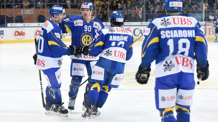 Davos`goalgette Enzo Corvi, Sven Jung and the team celebrate after scoring 1:2 during the game between HC Davos and Haemeenlinna PK at the 91th Spengler Cup ice hockey tournament in Davos, Switzerland ...