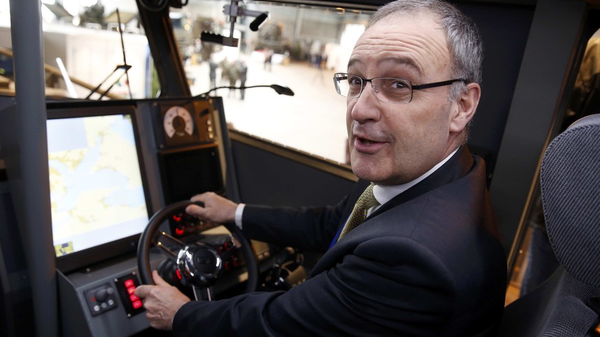 Swiss Defense Minister Guy Parmelin sits in the cockpit of a new Swiss Army boat during a presentation in the Swiss Army Base in Frauenfeld, Switzerland April 19, 2016. REUTERS/Ruben Sprich