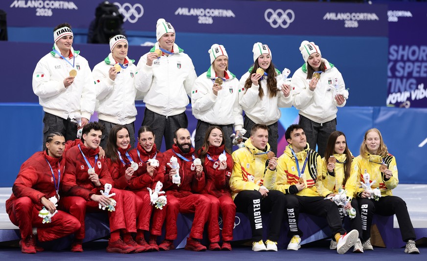 epa12723346 Gold medalists Team Italy (top), silver medalists team Canada (L) and bronze medalists team Belgium pose with their medals during the medal ceremony for the Mixed Team Relay Final A of the ...