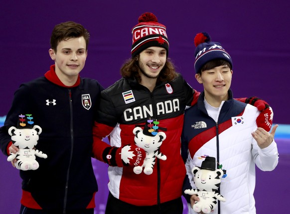 epa06536174 (L-R) Silver medal winner John-Henry Krueger of the USA, Gold medal winner Samuel Girard of Canada and Bronze medal winner Seo Yi-ra of Korea celebrate during the venue ceremony for the Me ...