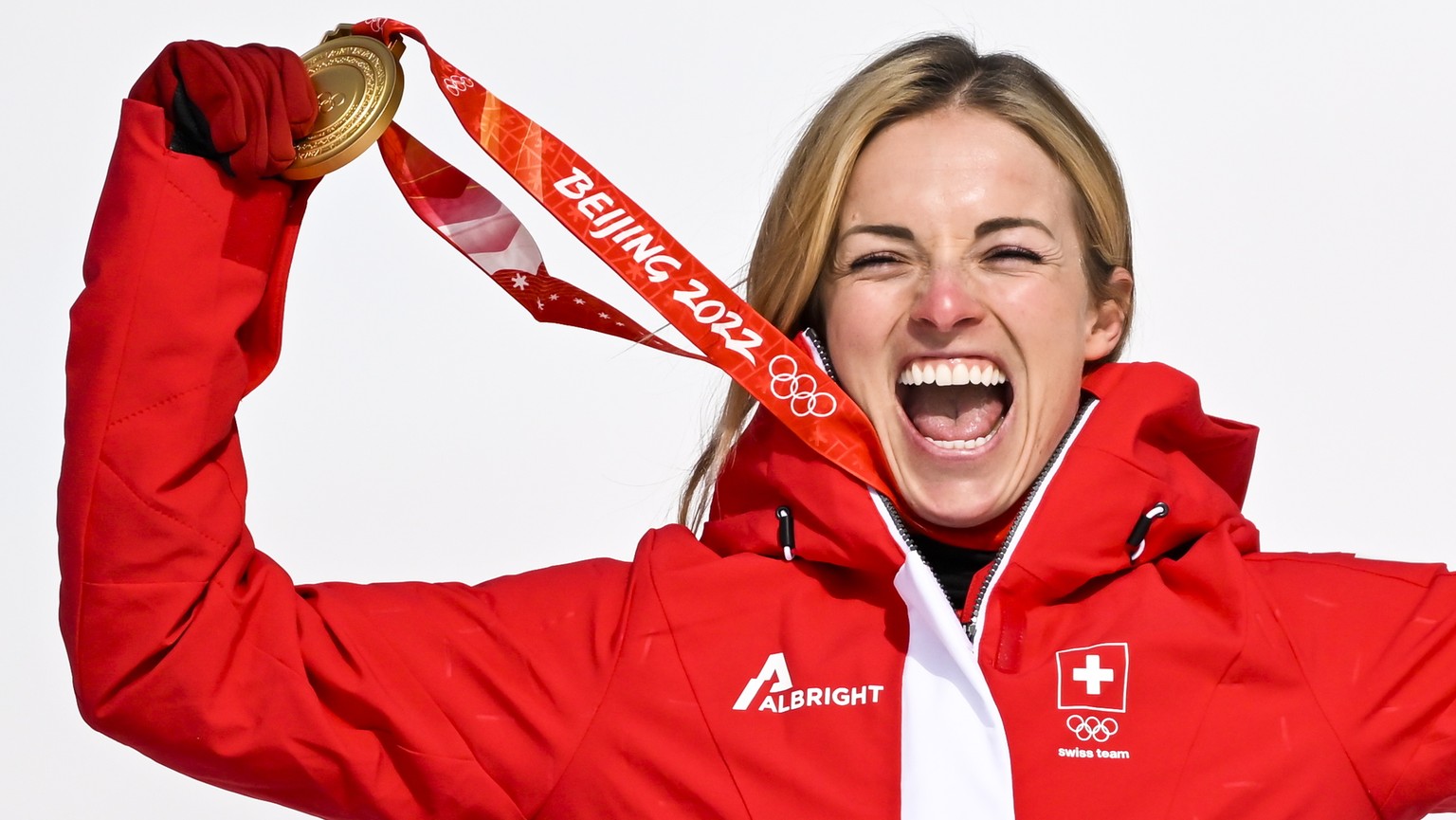 epa09745756 Gold medalist Lara Gut-Behrami of Switzerland celebrates during the victory ceremony of the Women&#039;s Super-G race of the Alpine Skiing events of the Beijing 2022 Olympic Games at the Y ...