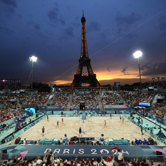 Canada&#039;s Melissa Humana-Paredes and Brandie Wilkerson, on left, face Switzerland&#039;s Zoe Verge-Depre and Esmee Boebner in a beach volleyball match at Eiffel Tower Stadium at the 2024 Summer Ol ...