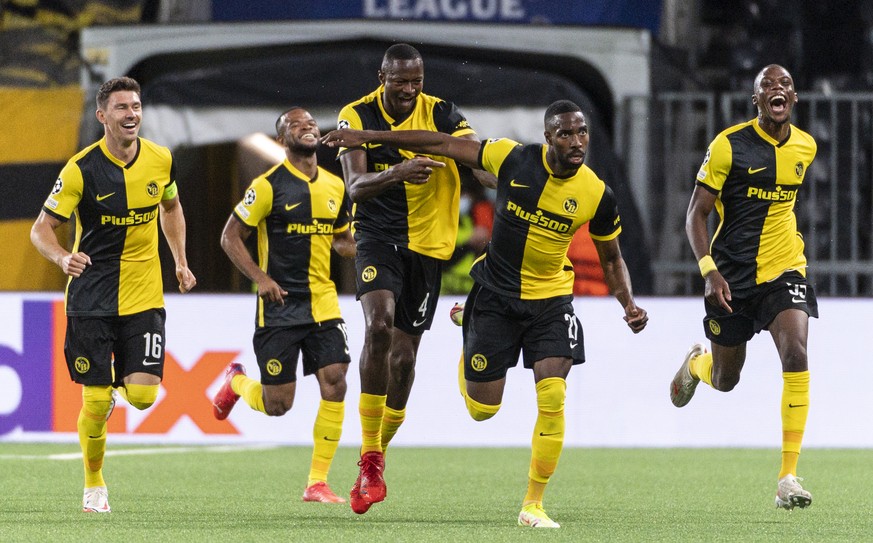 Young Boys&#039; Ulisses Garcia, 2nd right, celebrates with teanmates after scoring to 3:1 during the UEFA Champions League Play-off first leg soccer match between BSC Young Boys and Ferencvaros TC, o ...