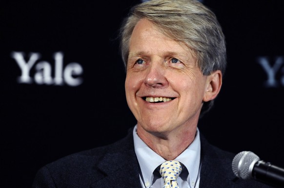 FILE - In this Oct. 14, 2013 file photo, Nobel prize-winning Yale University economist Robert Shiller smiles at a news conference in New Haven, Conn. In his new book with George Akerlof, another Nobel ...