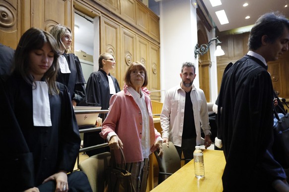 epa12440983 French mass-rape victim Gisele Pelicot (C), accompanied by her son Florian Pelicot (R), arrives at the Gard criminal court in Nimes, France, 09 October 2025. An appeal trial involving one  ...
