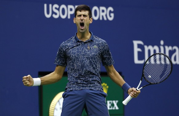 FILE - In this Sept. 9, 2018, file photo, Novak Djokovic, of Serbia, reacts after breaking the serve of Juan Martin del Potro, of Argentina, during the men's final of the U.S. Open tennis tournam ...