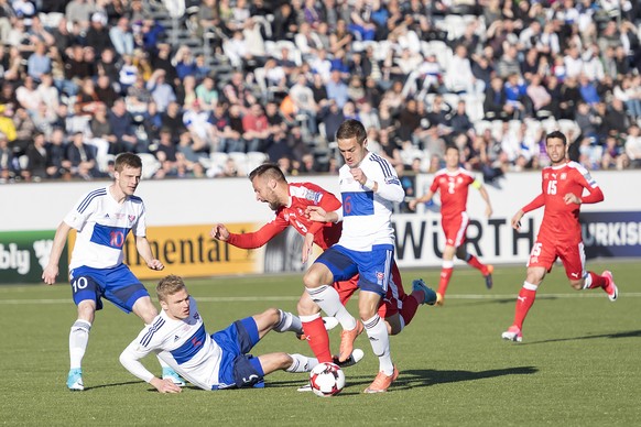 Faroe&#039;s Solvi Vatnhamar and Johan Davidsen, Switzerland&#039;s Haris Seferovic and Faroe&#039;s Hallur Hansson, from left, in action during the 2018 Fifa World Cup Russia group B qualification so ...