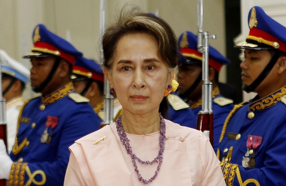 FILE - Myanmar&#039;s State Counselor Aung San Suu Kyi reviews an honor guard at the Peace Palace in Phnom Penh, Cambodia on April 30, 2019. A court in military-ruled Myanmar on Tuesday, April 26, 202 ...