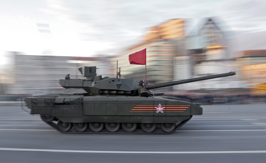 epa04733142 New Russian Armata T-14 tank drives along Tverskaya street during a rehearsal for a military parade in Moscow, Russia, 04 May 2015. The Victory Day parade on 09 May 2015 marks the 70th ann ...
