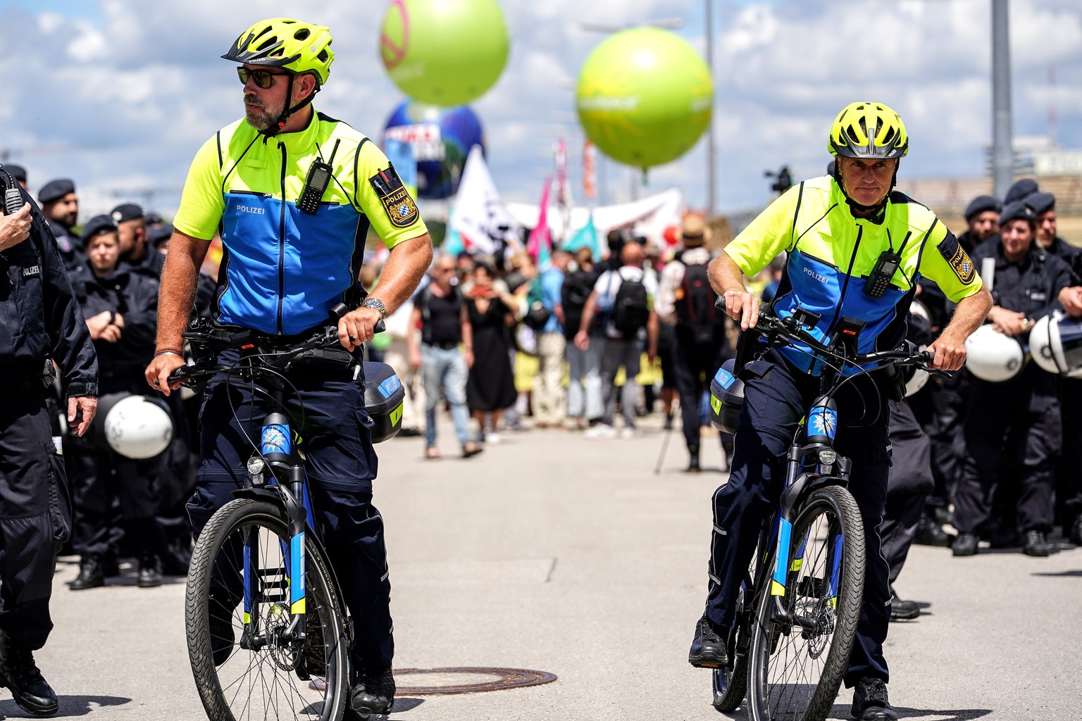 epa10033272 Police officers patrol during a demonstration related to the G7 Summit in Munich, Germany, 25 June 2022. Germany is hosting the G7 summit at Elmau Castle near Garmisch-Partenkirchen from 2 ...