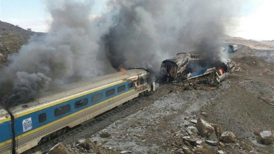 epa05646732 Smoke billows from destroyed train coaches at the site of a train accident in the city of Semnan, central Iran, 25 November 2016. According to media reports citing Iranian officials, at le ...