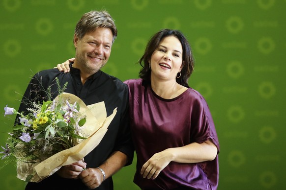 Green party leader Annalena Baerbock congratulates her co-leader Robert Habeck to his birthday as they arrive for a party&#039;s board meeting to discus yesterday&#039;s state elections in Saxony and  ...