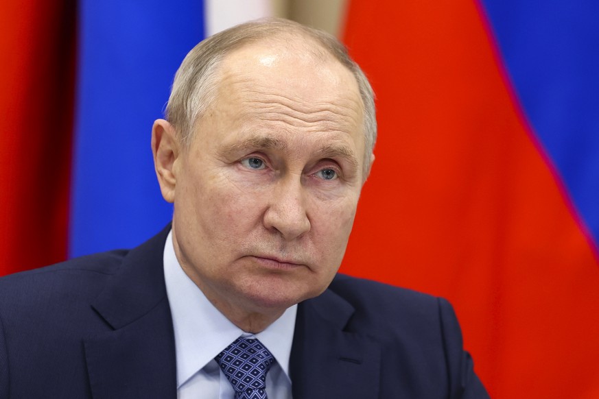 FILE - Russian President Vladimir Putin attends a meeting with officials in the town of Tsivilsk, Republic of Chuvash, Russia, Feb. 22, 2024. The U.S. government is hitting Russia with the largest tra ...