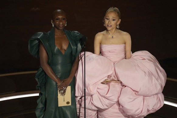 Cynthia Erivo, left, and Ariana Grande presents the award for best original song during the Oscars on Sunday, March 10, 2024, at the Dolby Theatre in Los Angeles. (AP Photo/Chris Pizzello)
Cynthia Eri ...