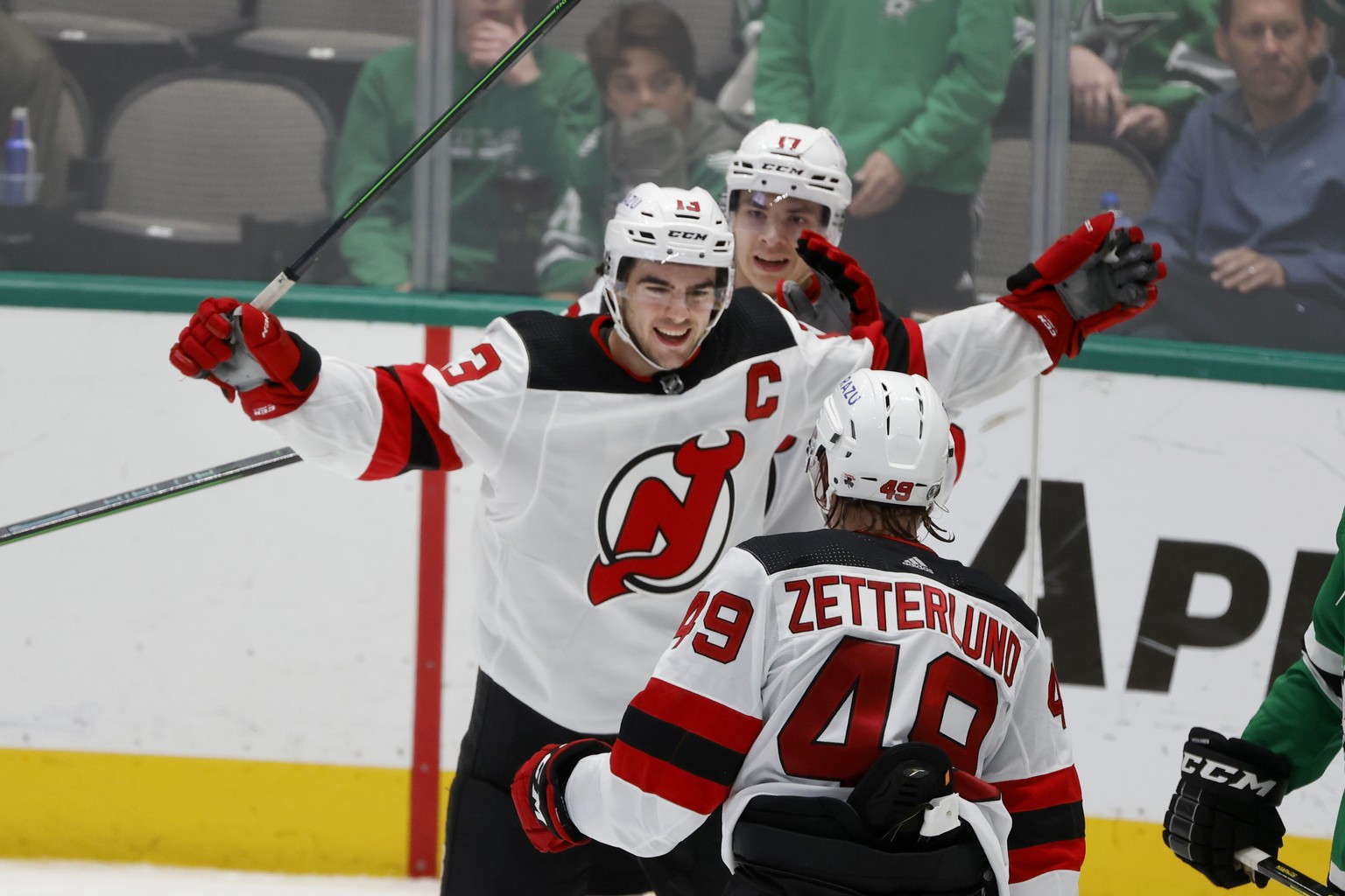 New Jersey Devils center Nico Hischier (13) celebrates his goal against the Dallas Stars with center Yegor Sharangovich (17) and left wing Fabian Zetterlund (49) during the third period of an NHL hock ...