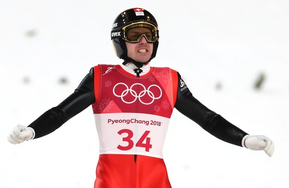 epa06536518 Simon Ammann of Switzerland reacts during the Men's Large Hill Individual Ski Jumping competition at the Alpensia Ski Jumping Centre during the PyeongChang 2018 Olympic Games, South Korea, 17 February 2018.  EPA/DIEGO AZUBEL