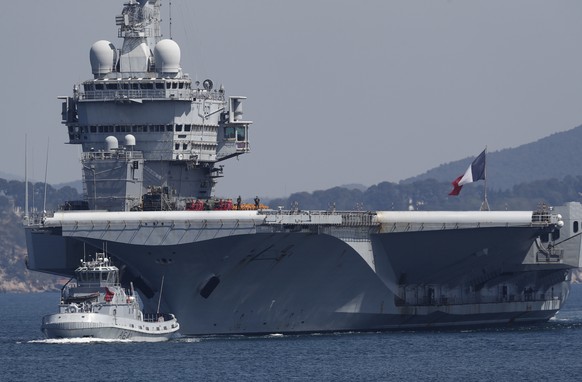 epa08359116 The French nuclear aircraft carrier Charles De Gaulle arrives back in Toulon military harbor, southern France, 12 April 2020. The aircraft carrier Charles De Gaulle which was deployed in t ...