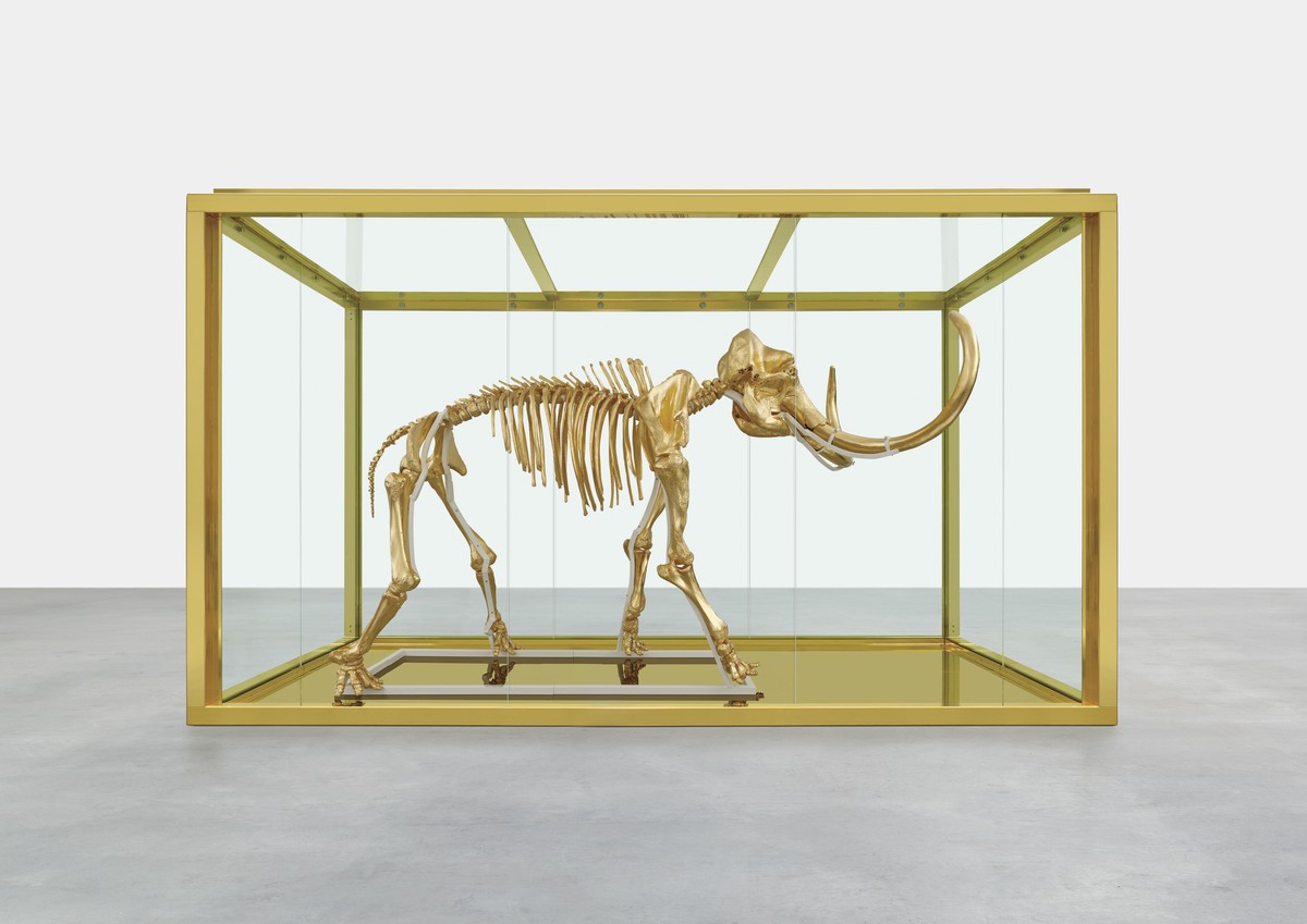 In this undated photo released by Damien Hirst and Science Ltd., British artist Damien Hirst's latest piece entitled "Gone but Not Forgotten", which features the gilded skeleton of a wo ...