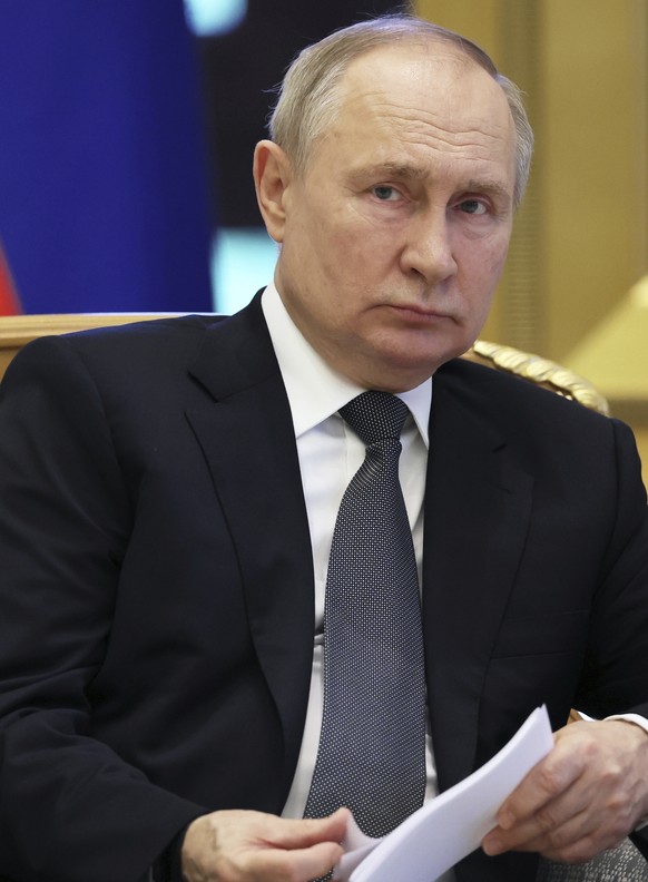 Russian President Vladimir Putin listens to Emirati President Sheikh Mohammed bin Zayed Al Nahyan during their talks at Qasr Al Watan, Abu Dhabi, United Arab Emirates, Wednesday, Dec. 6, 2023. (Sergei ...