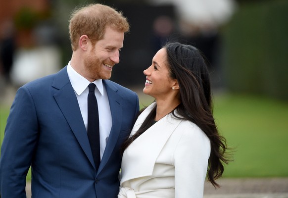 epa08116522 (FILE) - Britain&#039;s Prince Harry pose with Meghan Markle during a photocall after announcing their engagement in the Sunken Garden in Kensington Palace in London, Britain, 27 November  ...