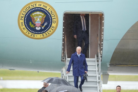 U.S. President Joe Biden walks down the steps of Air Force One upon arrival at Marine Corps Air Station Iwakuni, western Japan, Thursday, May 18, 2023, en route to Hiroshima for the Group of Seven nat ...
