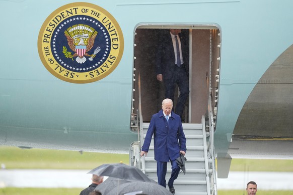 US President Joe Biden walks down the steps of Air Force One upon arrival at Marine Corps Air Station Iwakuni, Western Japan, Thursday, May 18, 2023, en route to Hiroshima for the Group of Seven nat...