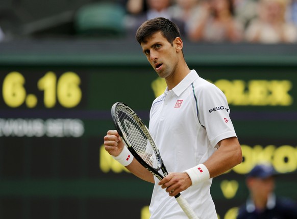 Novak Djokovic of Serbia reacts to breaking serve during his match against Marin Cilic of Croatia at the Wimbledon Tennis Championships in London, July 8, 2015. REUTERS/Suzanne Plunkett