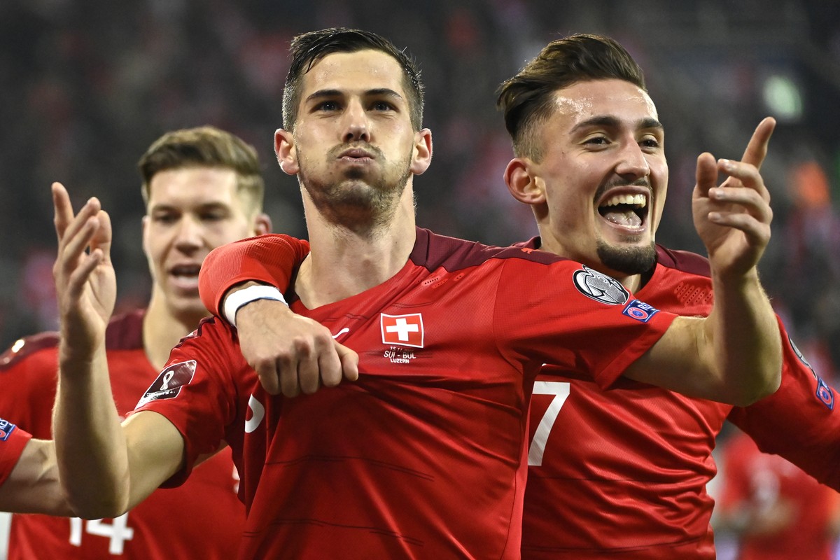Switzerland's midfielder Remo Freuler, left, celebrates his goal after scoring the 4 - 0 with Switzerland's forward Andi Zeqiri, right, during the 2022 FIFA World Cup European Qualifying Gro ...