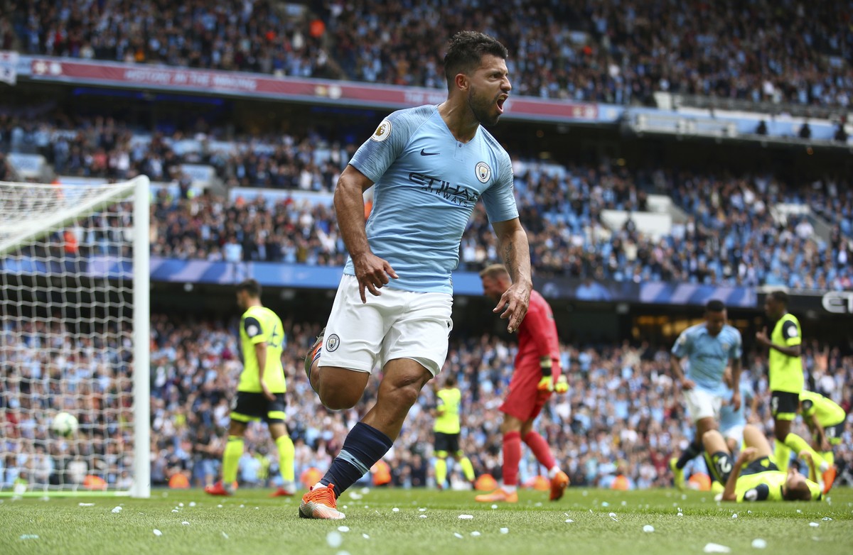 Manchester City's Sergio Aguero celebrates scoring his side's third goal of the game during the English Premier League soccer match between Manchester City and Huddersfield Town at the Etiha ...