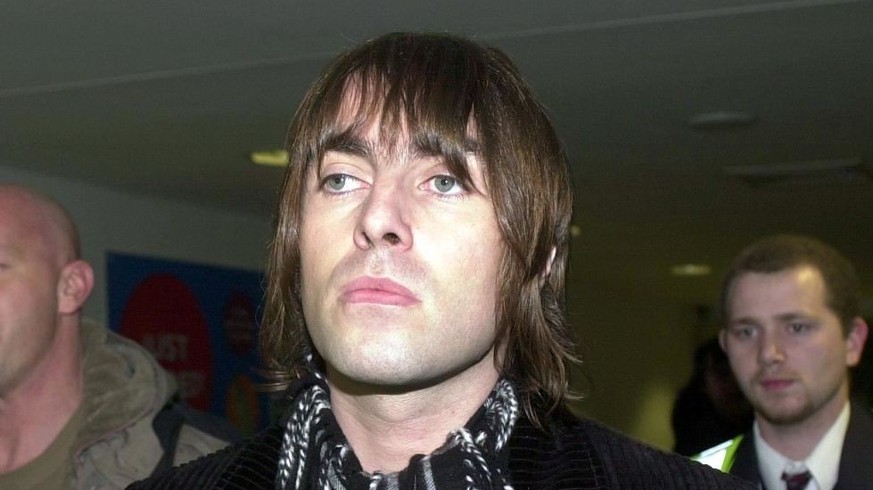 Oasis star Liam Gallagher arrives back in the UK at Heathrow airport after allegedly assaulting a German policeman in a bust-up at a smart Munich hotel. The rock star could face up to two years in pri ...
