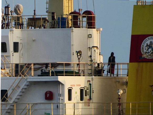 This photograph shared by Indian navy on the X platform shows people on board the hijacked ship ex-MV Ruen, Saturday, March 16, 2024. Indian navy says that it has intercepted the ship and has demanded ...