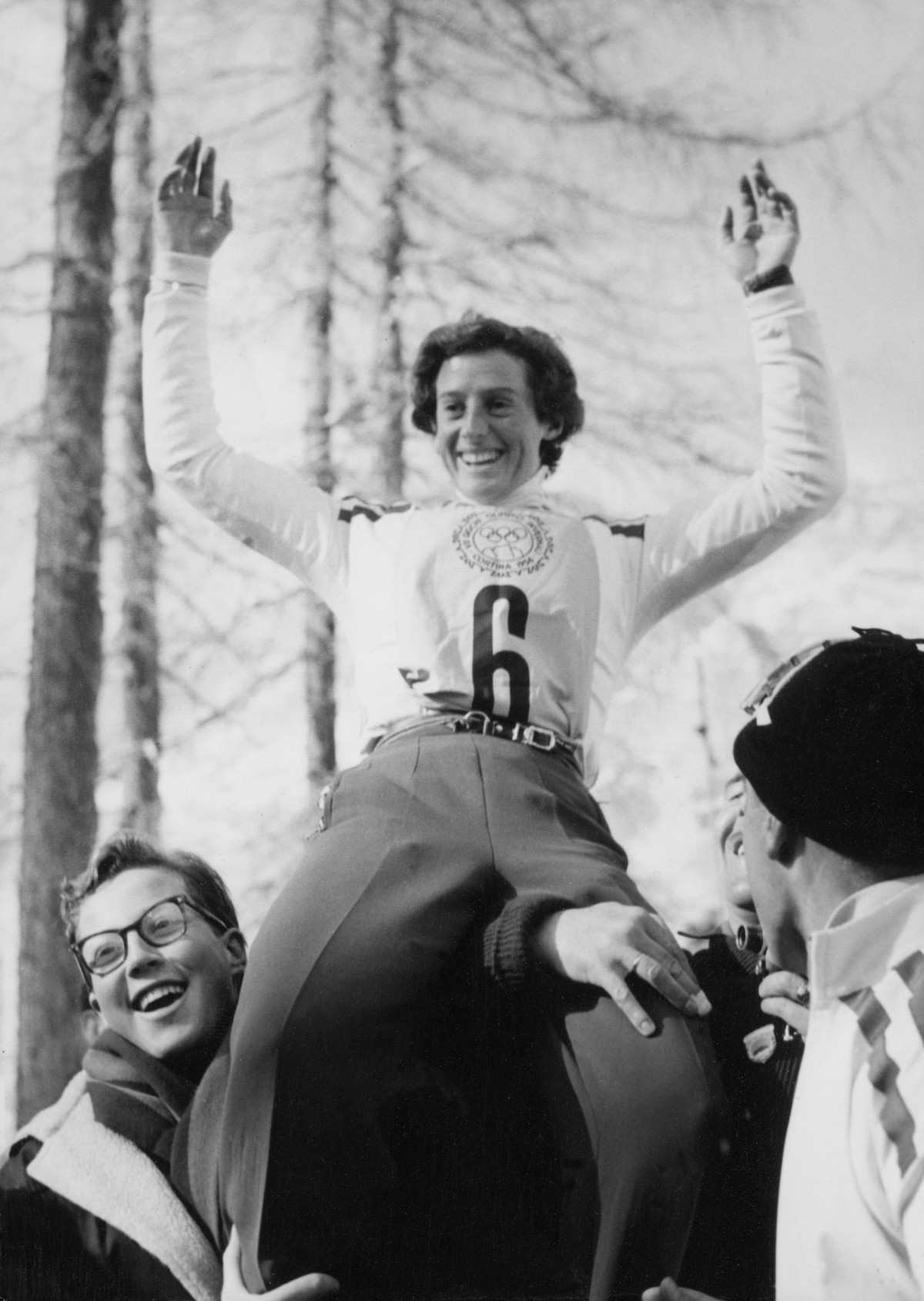 Orig. caption... WINTER OLYMPICS IN CORTINA. Gold medalist in the women s downhill, Madeleine Berthod, Switzerland, is hoisted after her victory. 3/2 1956 Note. M Chamot-Berthod, born 1931, Swiss alpi ...