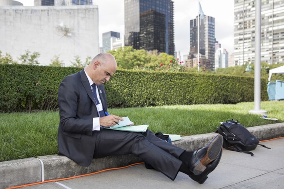 epa07049276 Swiss Federal President Alain Berset makes notes during a short break between bilateral meetings on the sidelines of the 73rd session of the General Assembly of the United Nations at Unite ...