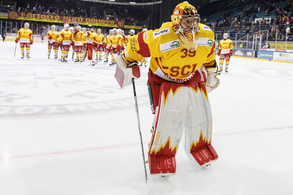 Tigers&#039; goaltender Luca Boltshauser #39 and his teammates celebrate their victory after defeating the team Geneve-Servette, during a National League regular season game of the Swiss Championship  ...