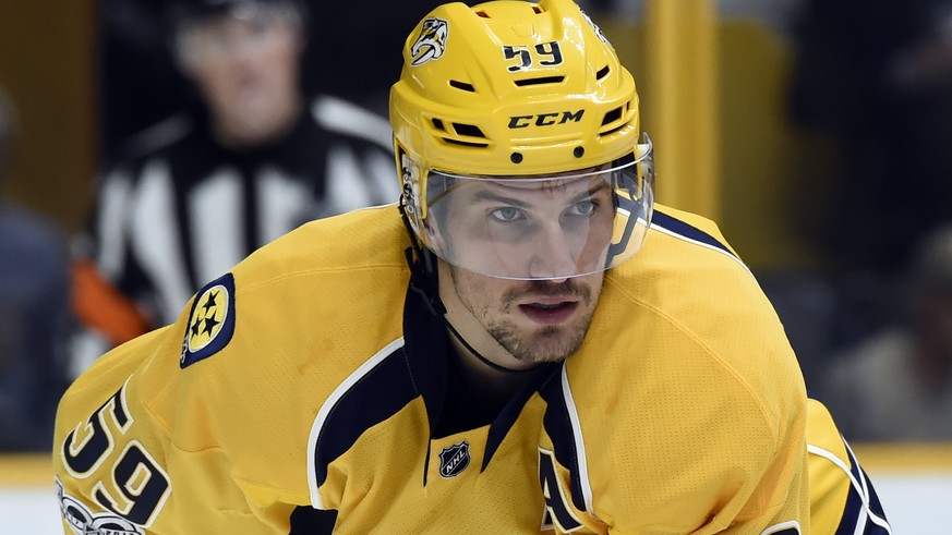 FILE - In this c, Nashville Predators defenseman Roman Josi, of Switzerland, plays against the Toronto Maple Leafs during the first period of an NHL hockey game in Nashville, Tenn. The Predators named ...