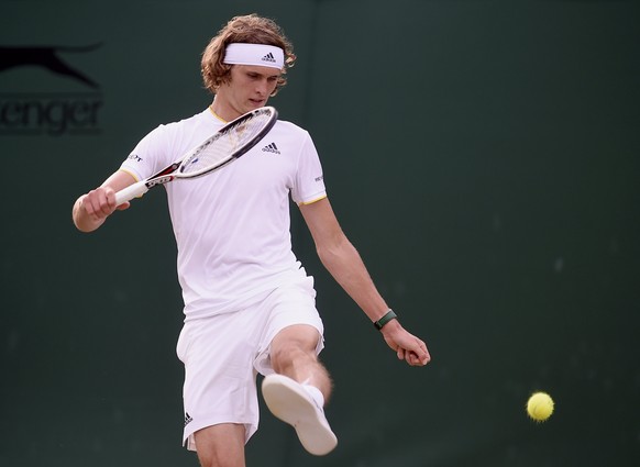 epa06070899 Alexander Zverev of Germany in action against Frances Tiafoe of the USA during their second round match for the Wimbledon Championships at the All England Lawn Tennis Club, in London, Brit ...