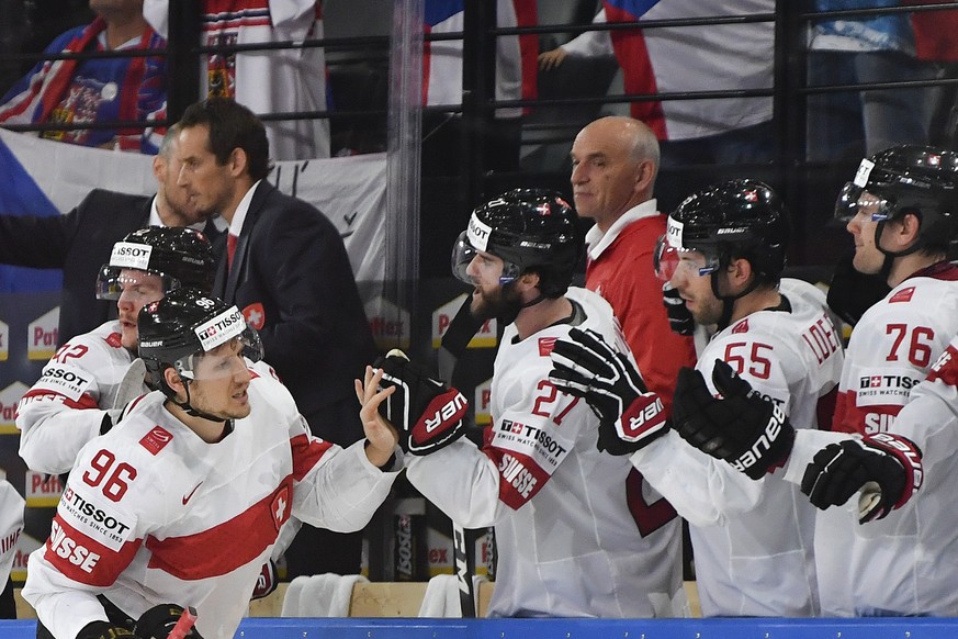 Switzerland’s Damien Brunner, Dominik Schlumpf, Romain Loeffel and Joel Genazzi, from left, celebrate their third goal during their Ice Hockey World Championship group B preliminary round match betwee ...