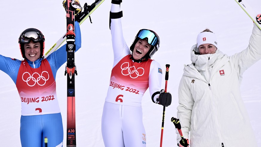 epa09734717 (L-R) second placed Federica Brignone of Italy, winner Sara Hector of Sweden and third placed Lara Gut-Behrami of Switzerland celebrate on the podium for the the Women&#039;s Giant Slalom  ...