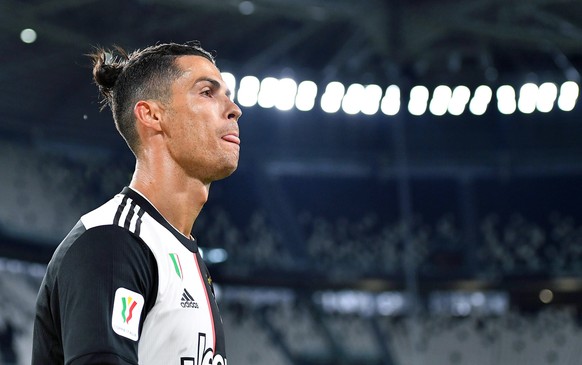 epa08481695 Juventus&#039; Cristiano Ronaldo reacts during the Coppa Italia semi final, second leg soccer match between Juventus FC and AC Milan in Turin, Italy, 12 June 2020. EPA/ALESSANDRO DI MARCO