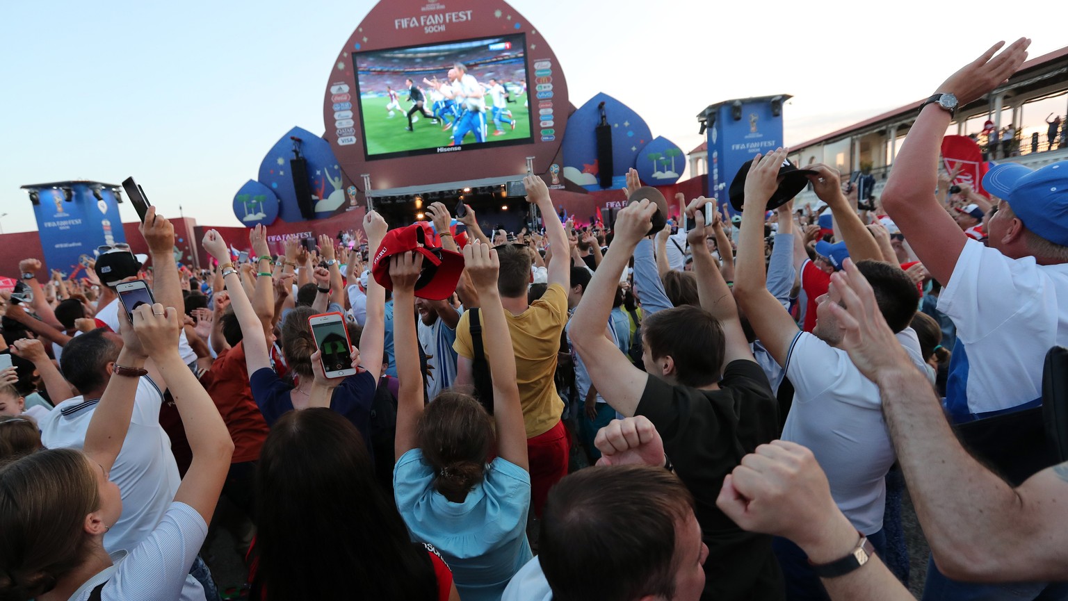 epa06855811 Supporters of Russia celebrate their team&#039;s victory during a public viewing of the FIFA World Cup 2018 round of 16 soccer match between Spain and Russia at the FIFA Fan Zone in Sochi, ...