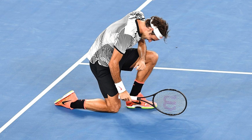epa05759246 Roger Federer of Switzerland celebrates winning against Rafael Nadal of Spain during the finals of the Men&#039;s Singles at the Australian Open Grand Slam tennis tournament in Melbourne,  ...