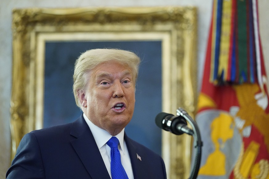 President Donald Trump speaks before awarding the Presidential Medal of Freedom, the highest civilian honor, to Olympic gold medalist and former University of Iowa wrestling coach Dan Gable in the Ova ...