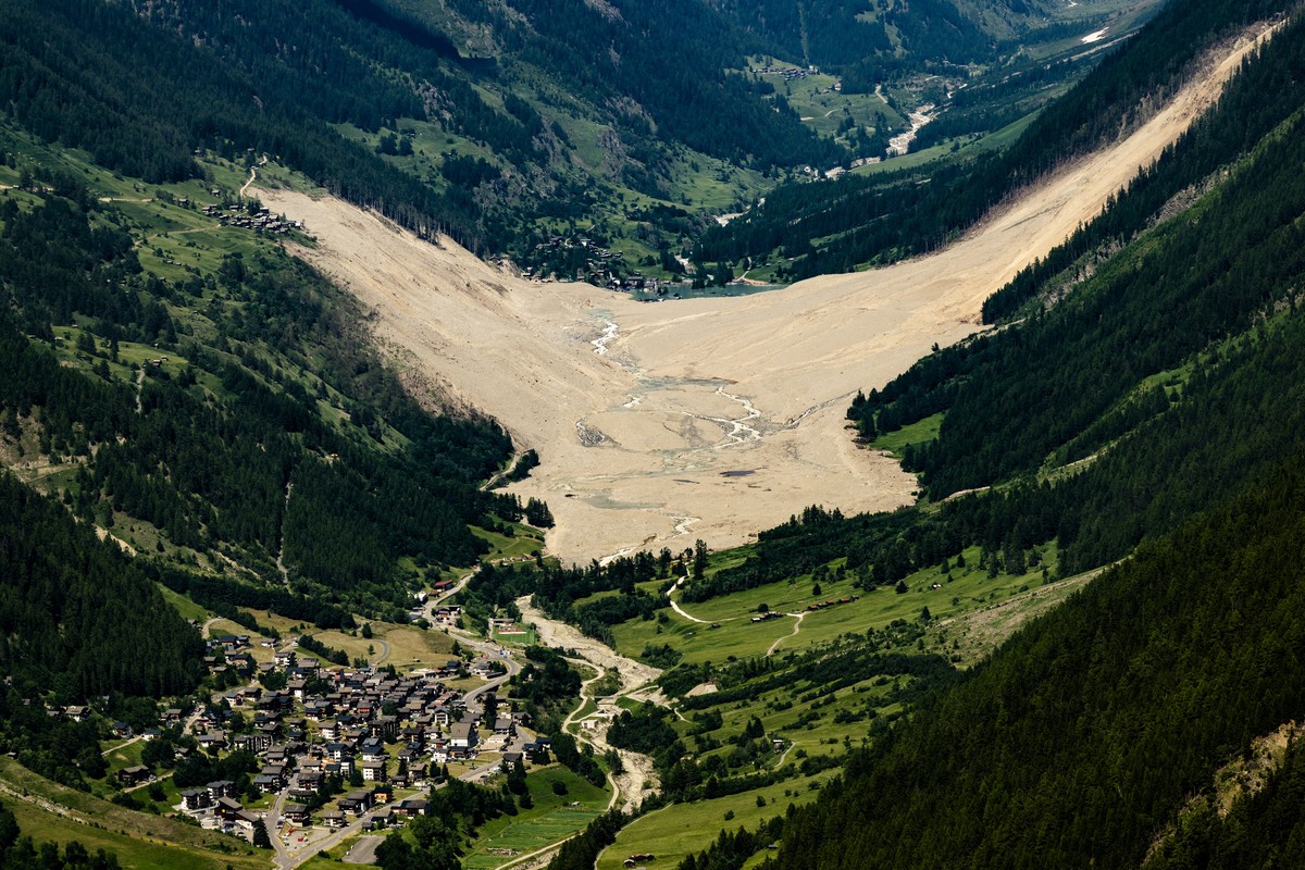 epa12185910 A view of the Loetschental valley with the landslide that largely devastated the Valais village of Blatten, Switzerland, 19 June 2025, above Ferden. The Valais village of Blatten was hit b ...